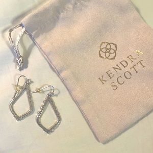 Silver earrings with dust bag.